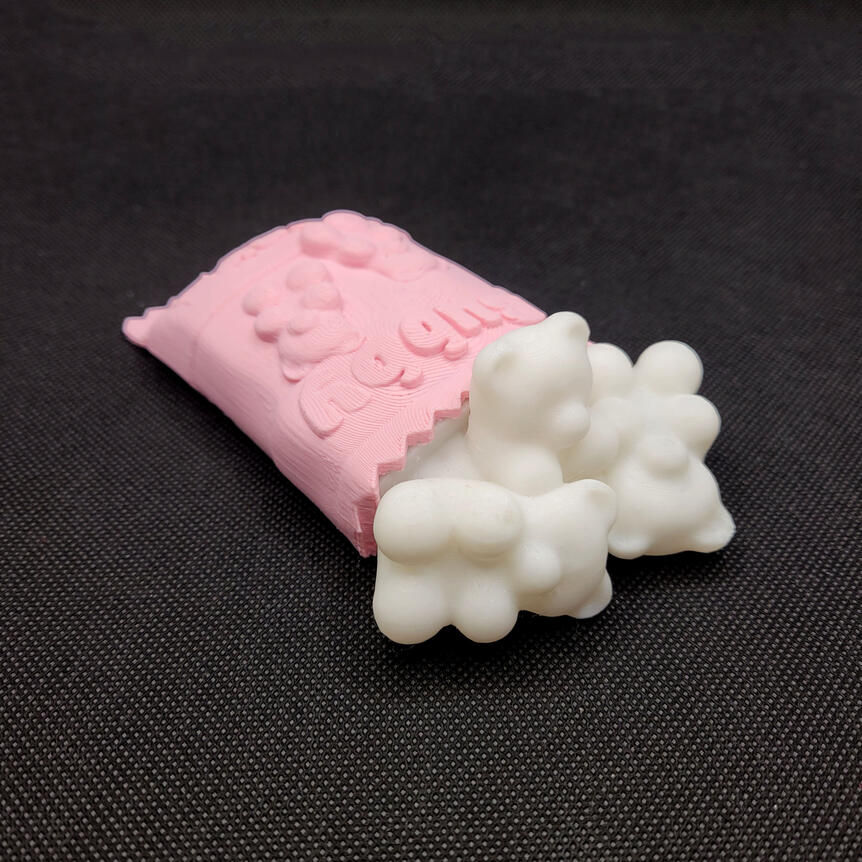 Untitled Small 3D printed light made to look like a spilled bag of gummy bears. The light is turned off.