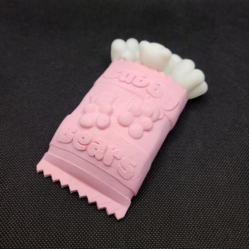 Untitled Small 3D printed light made to look like a spilled bag of gummy bears. The light is turned off.